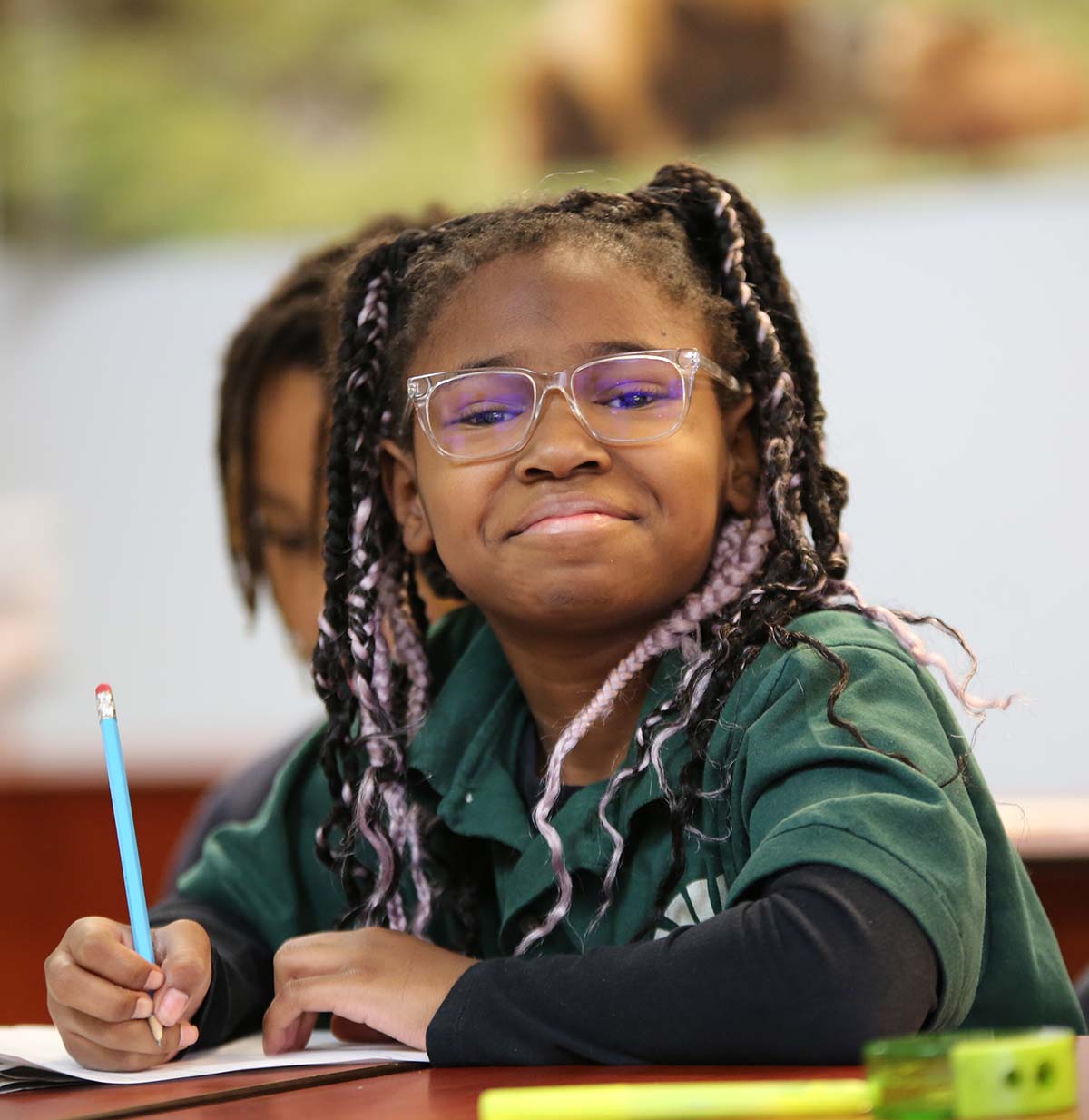 Student drawing in a classroom.