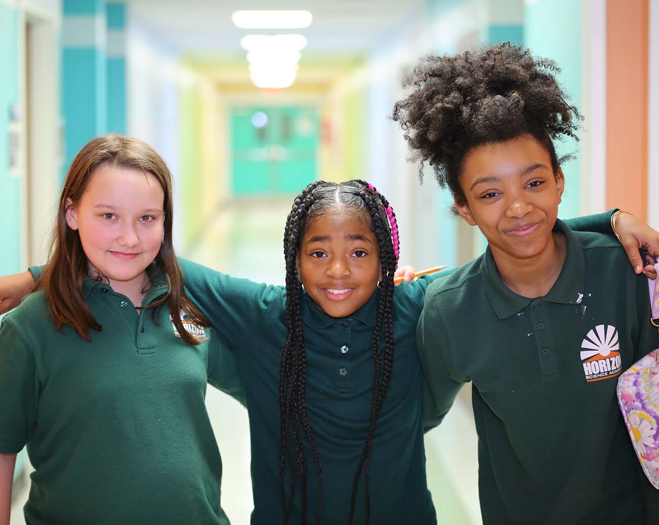Teacher or school staff member warmly interacting with a student outside